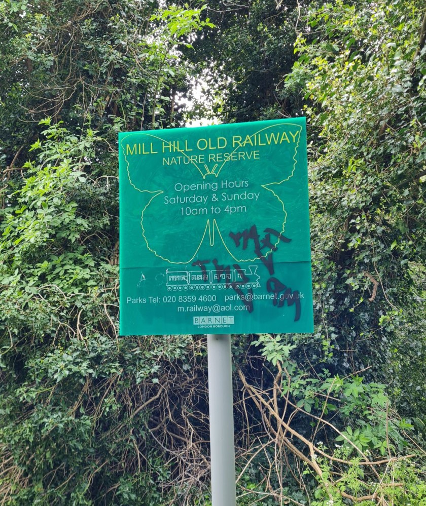 Sign marking the start of the Mill Hill Old Railway Nature Reserve.