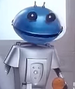 Robot in Cadbury's advert with a round blue head with black eyes and a wide black mouth, and a square silver body.