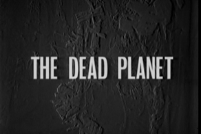 Title card which reads 'The Dead Planet'. In the background is a fossilised jungle.